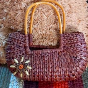 Cute boho wicker bag with wooden handles, lined inside with zipper closure